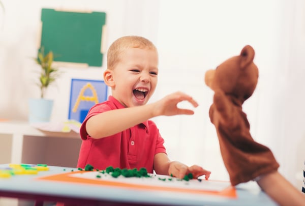 Child playing and learning at desk