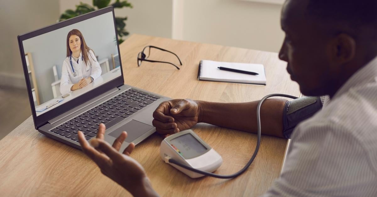 An RPM patient with a chronic disease speaks with their doctor through a video conference call 