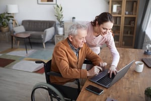 home health reimbursement specialist with patient in wheelchair