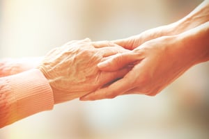 hospice care holding hands