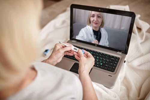 A patient speaks to their doctor during a telemedicine virtual visit.