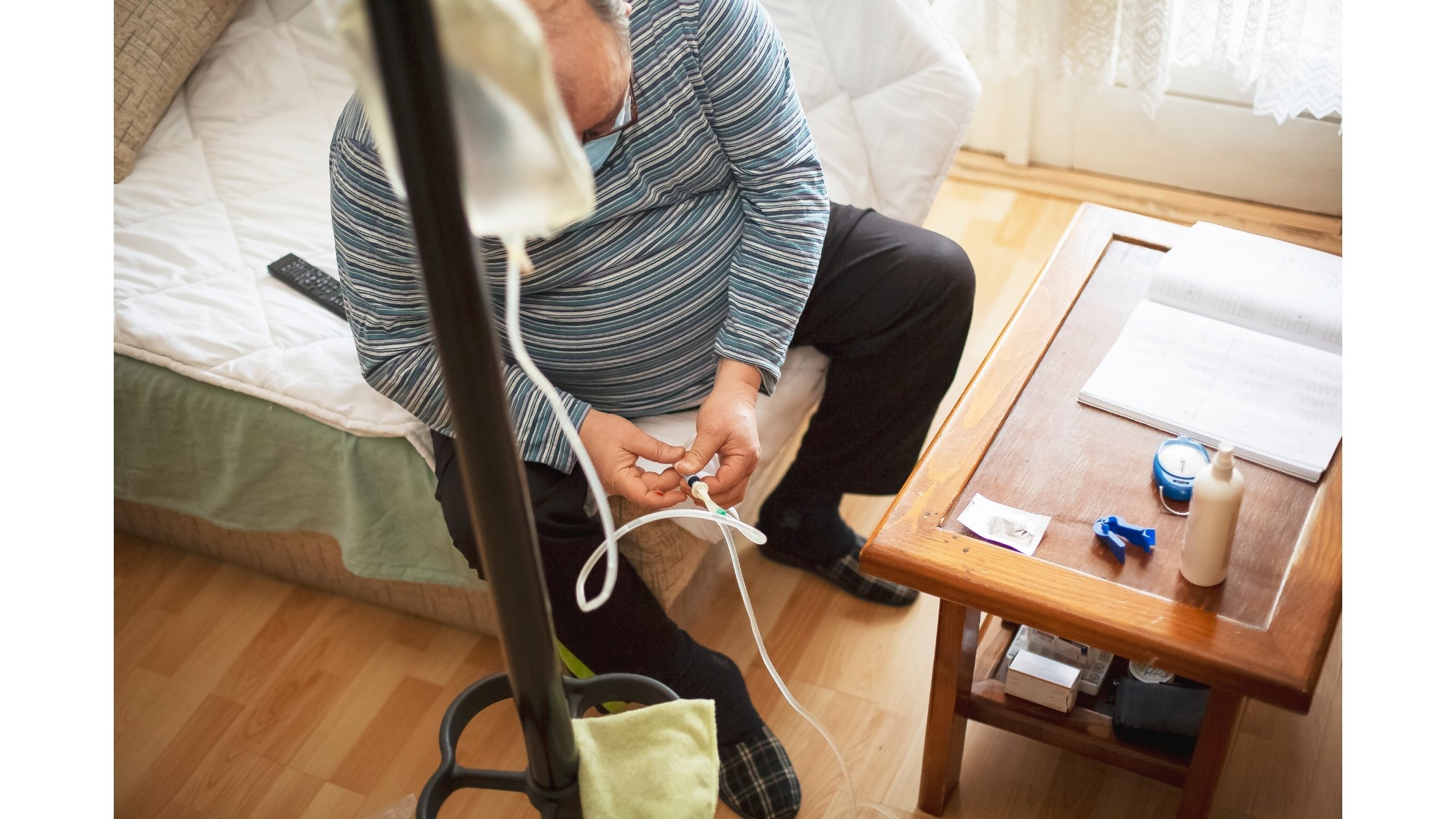 Kidney patient connecting peritoneal dialysis to an IV catheter