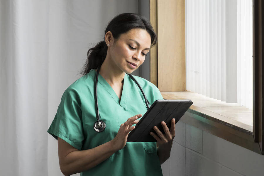 Nurse looking at tablet